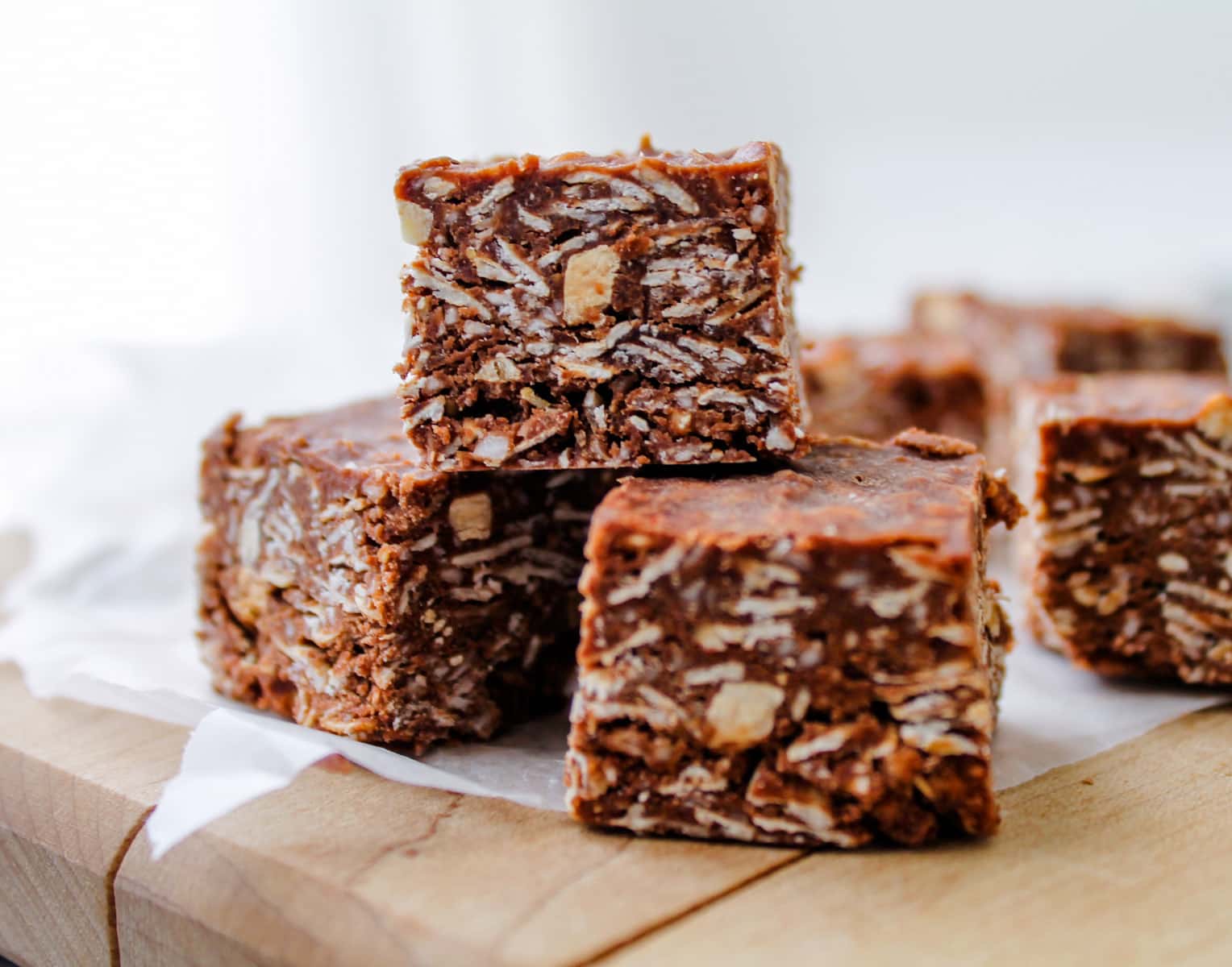 a stack of no bake chocolate oat bars.