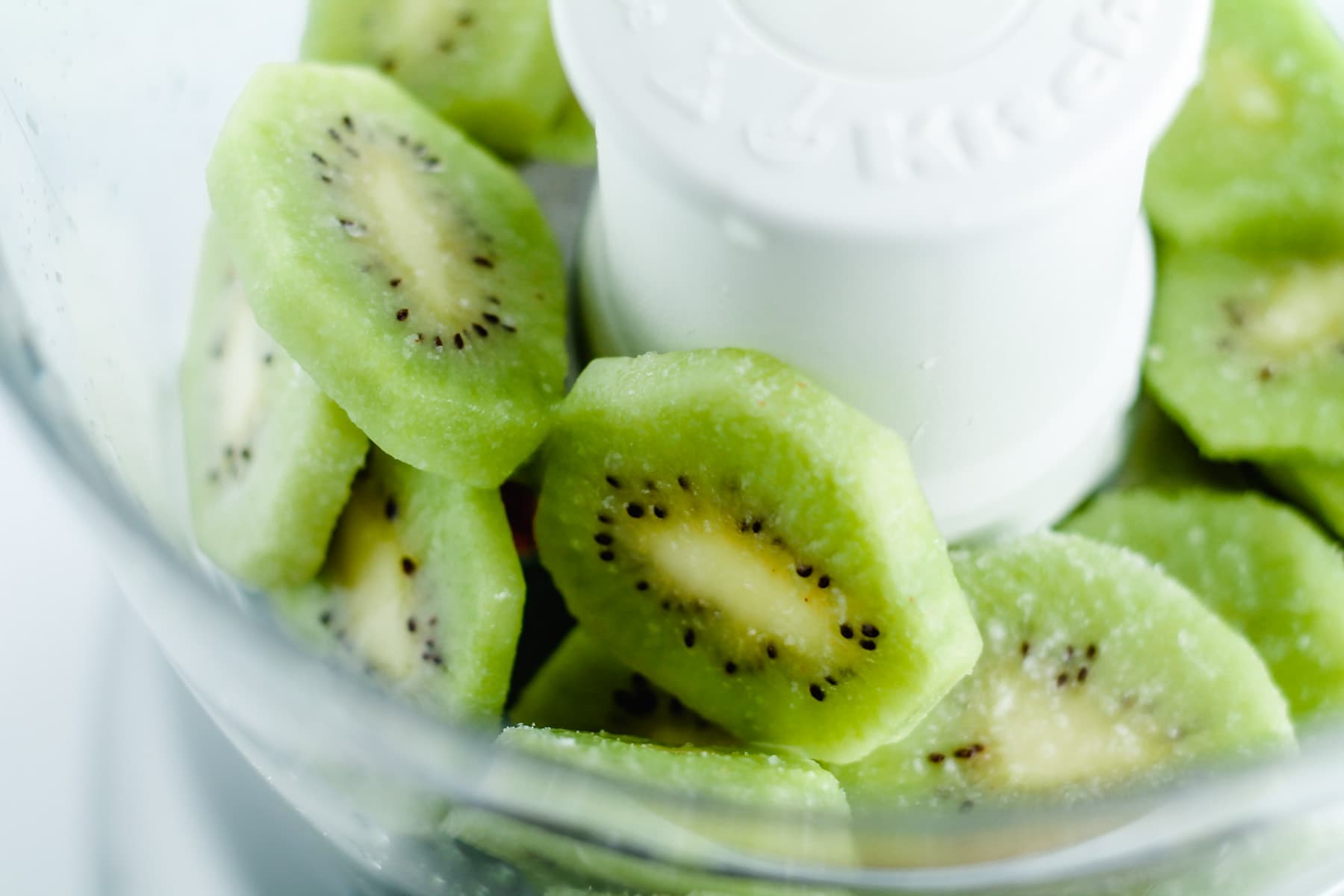 slices of kiwi in a food processor.