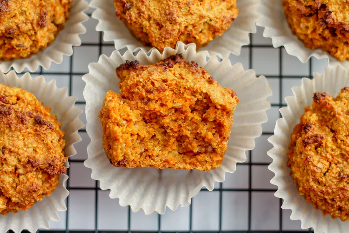 a carrot spelt flour muffins with a bite out of it.
