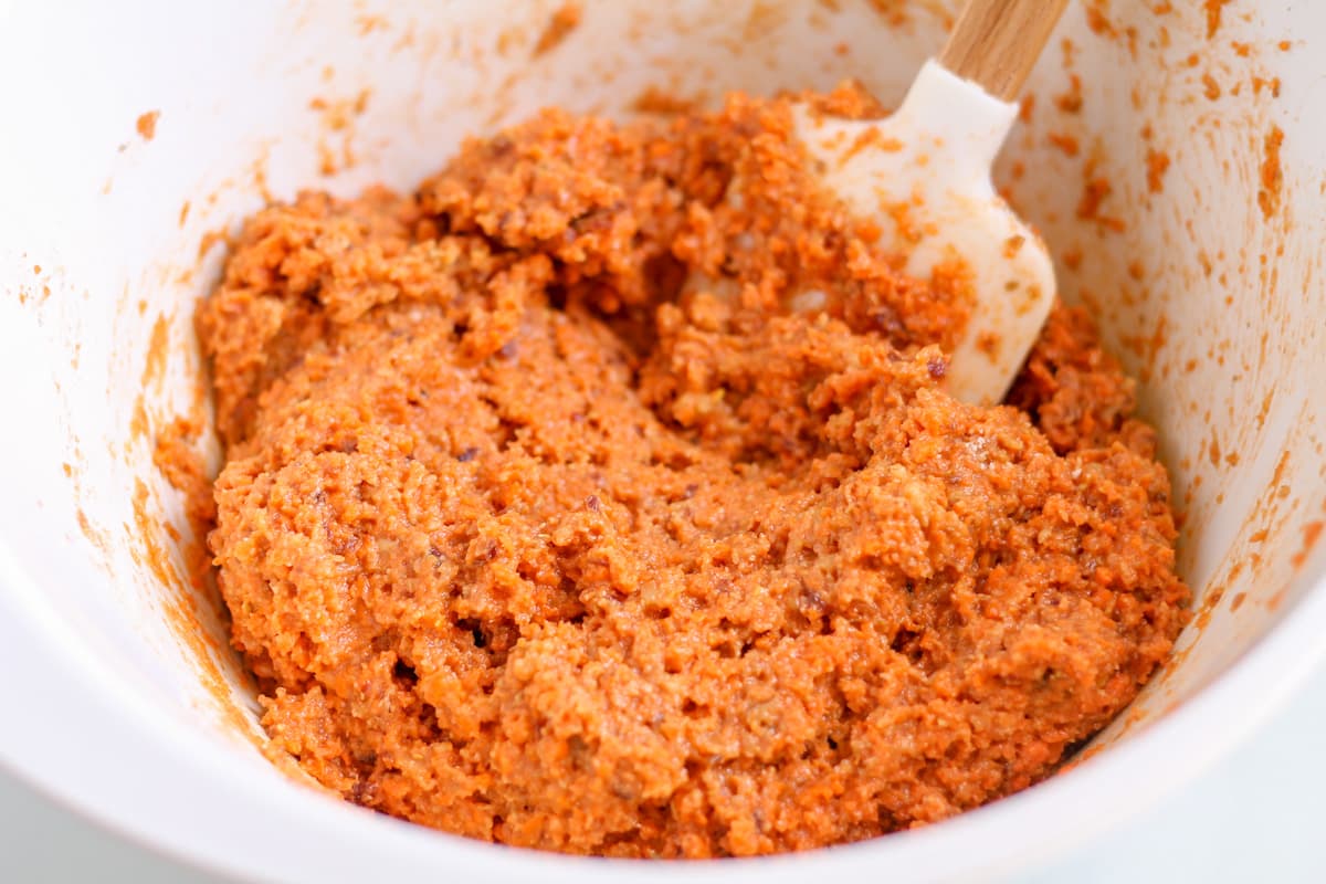 batter being stirred in a mixing bowl.