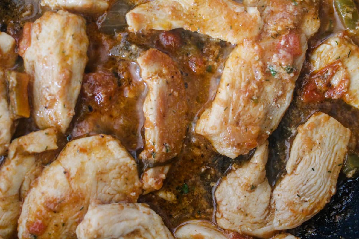 chicken cooking with ranch salsa dressing.