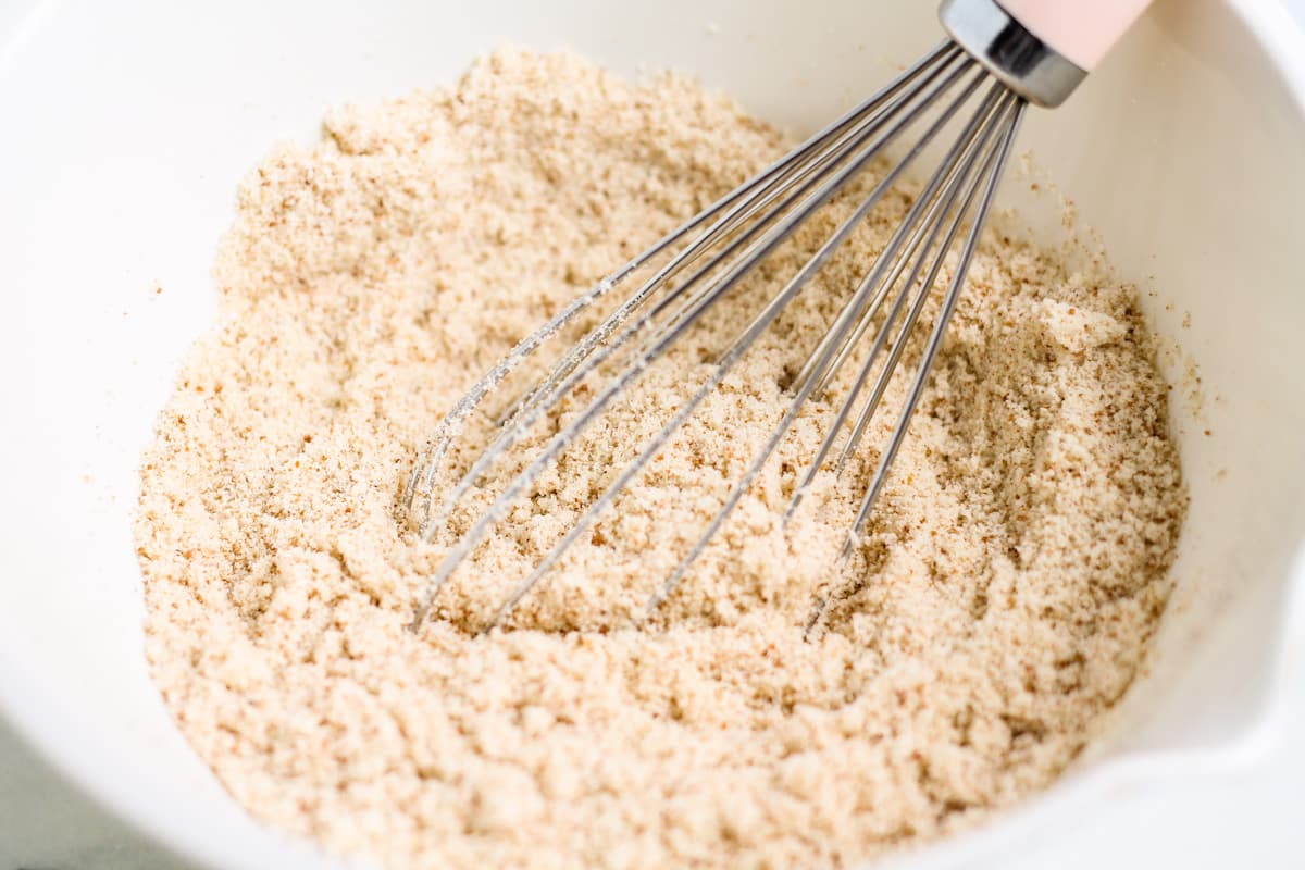 almond flour being whisked with other dry ingredients.