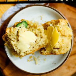 a plate of buttered jalapeno muffins.