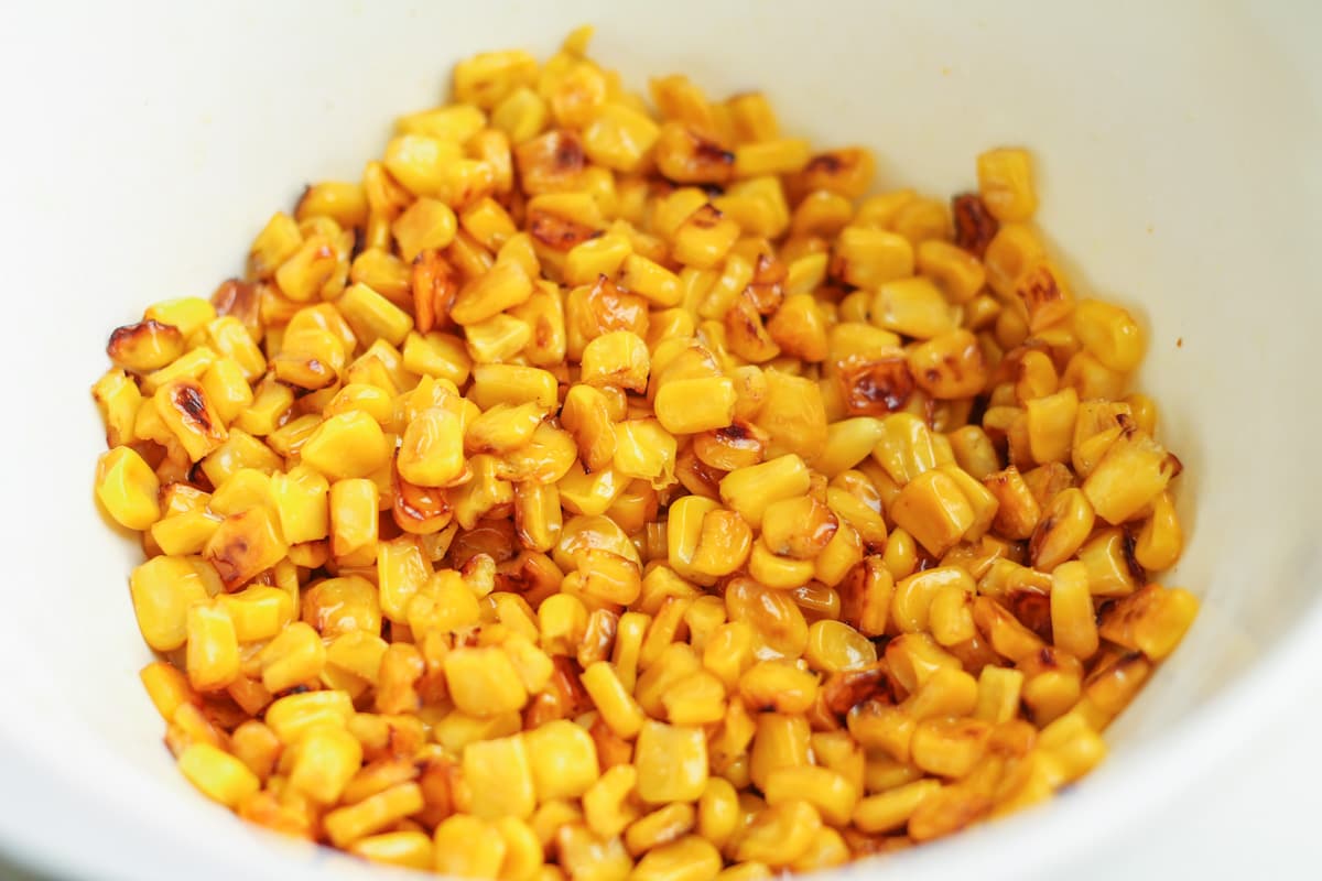 charred corn in a mixing bowl.