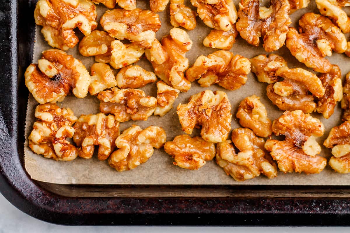 spiced nuts on a baking sheet.