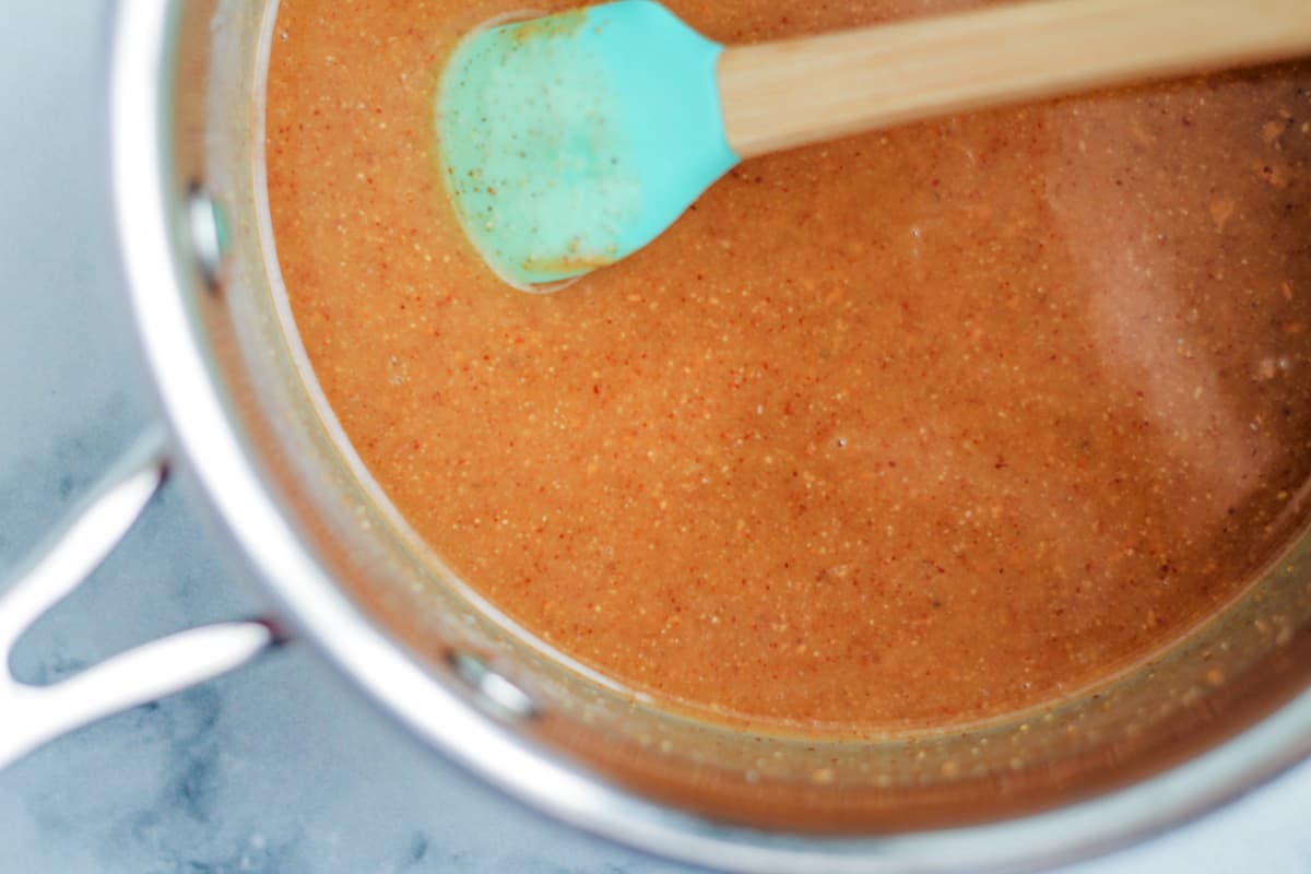 wet ingredients being warmed over low heat in a saucepan.
