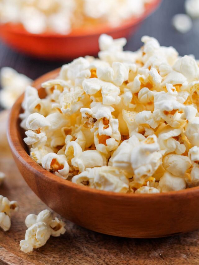 two bowls of coconut oil popcorn on a table.