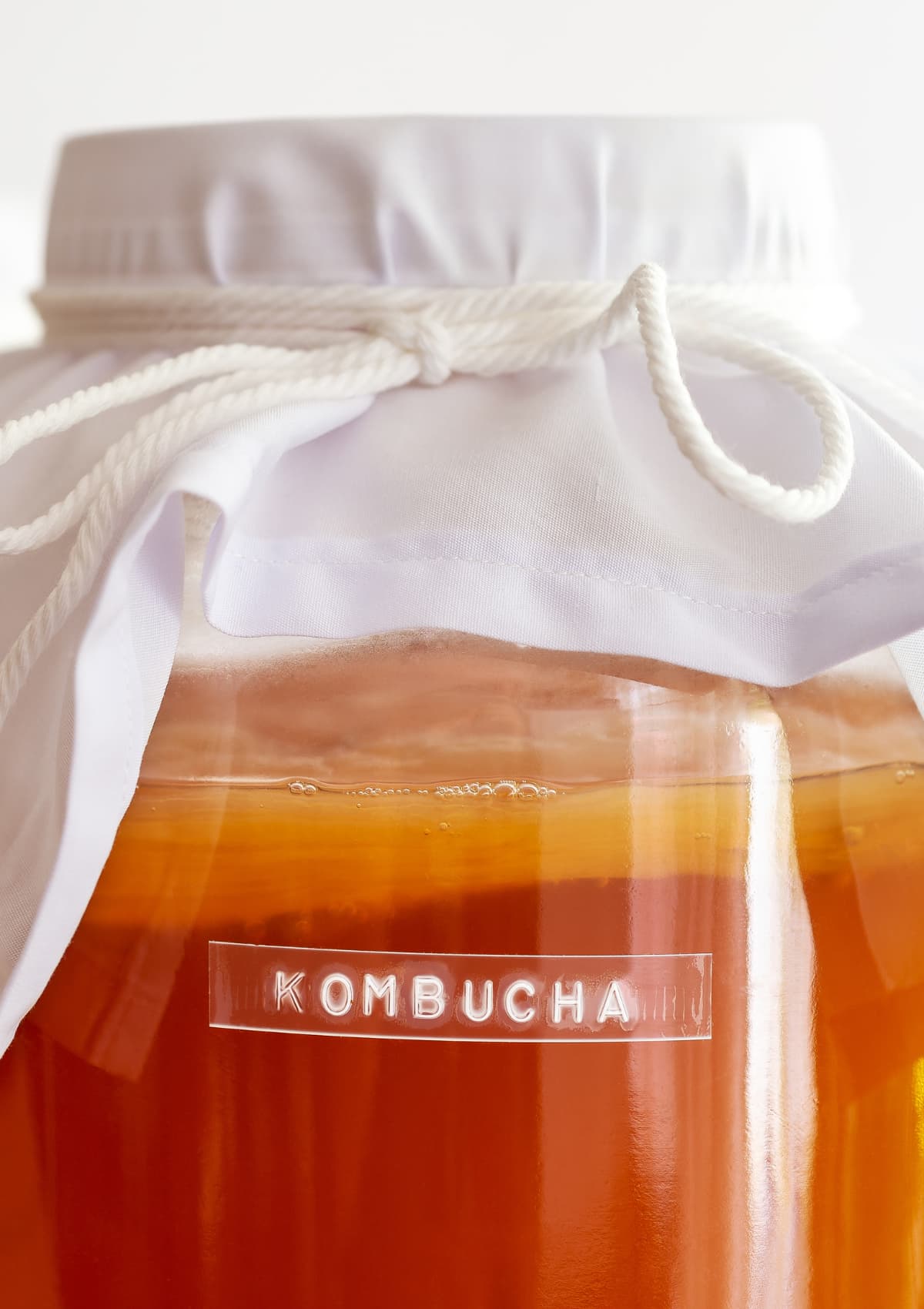 A large jar of homemade kombucha.