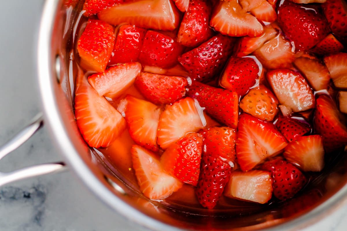 a pan with sliced strawberries in it.