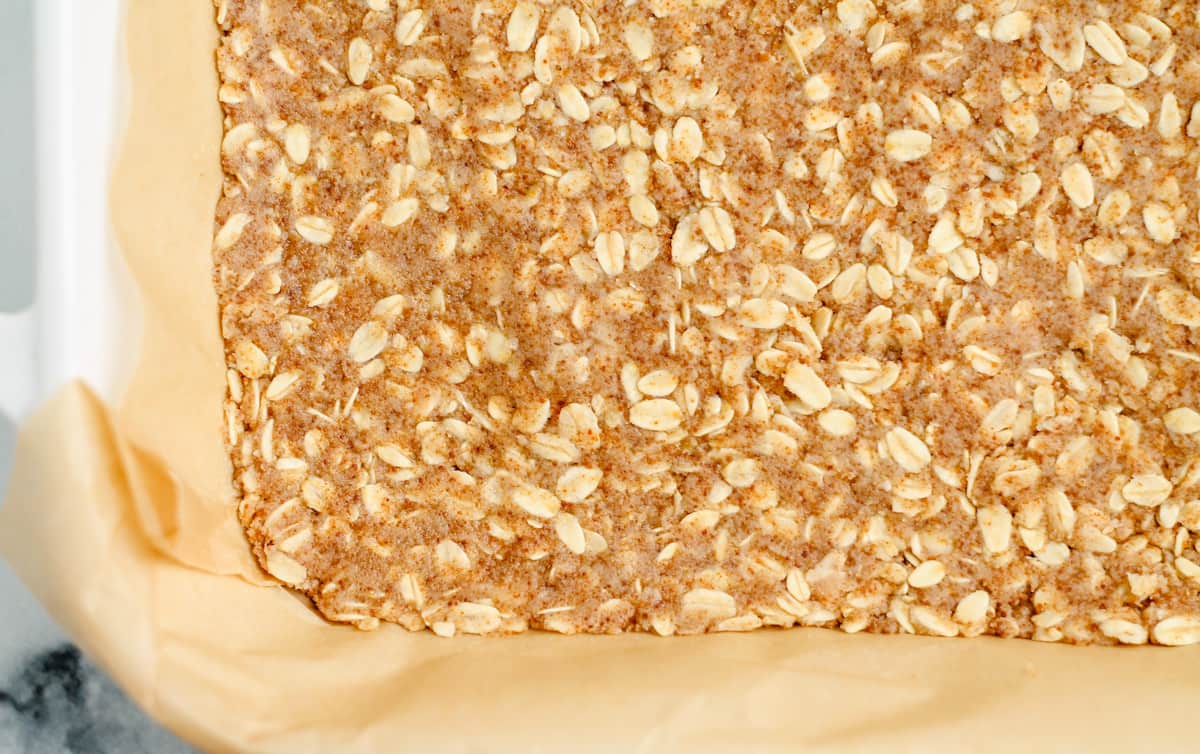 oat crust pressed into a baking dish.