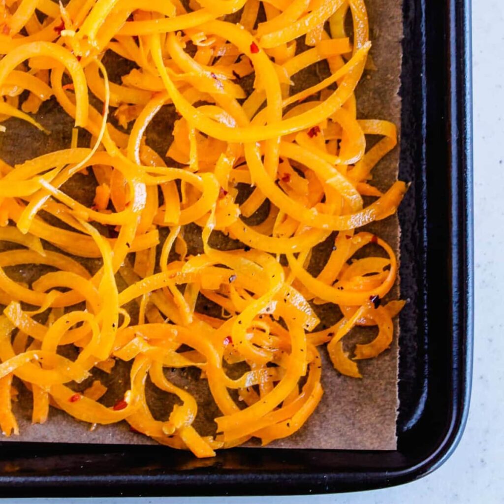 A baking tray with veggie noodles.