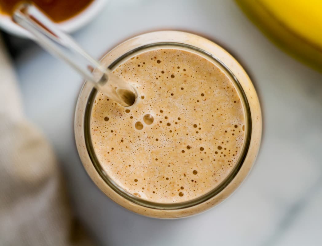 Overhead image of a creamy Banana Almond Butter Smoothie.