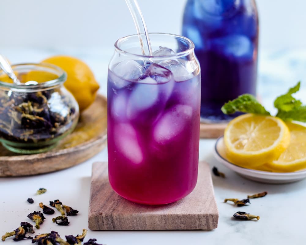 A glass of purple Butterfly pea tea.