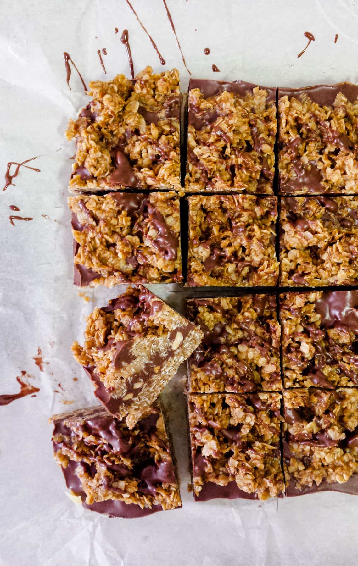 Overhead image of a tray  of sliced chocolate peanut butter oat bars.