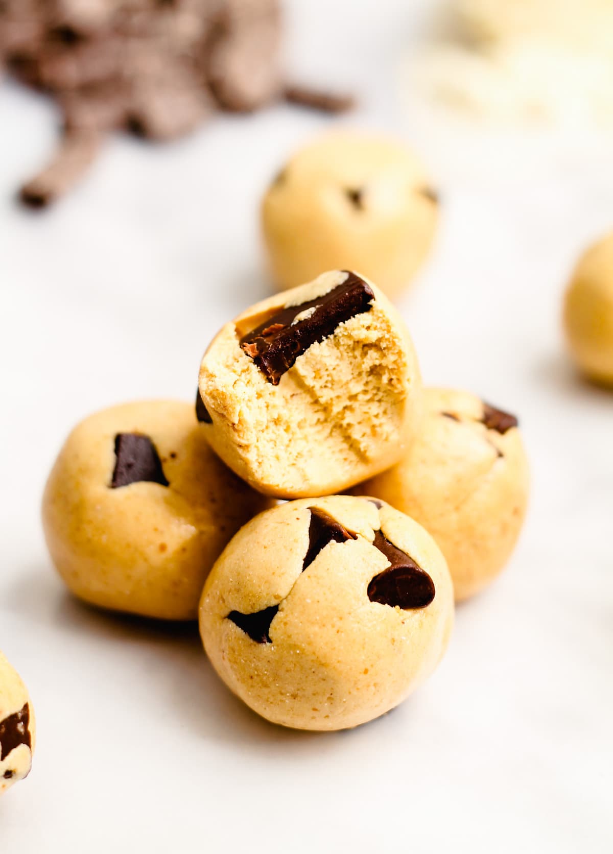 Cookie dough protein balls on a counter.
