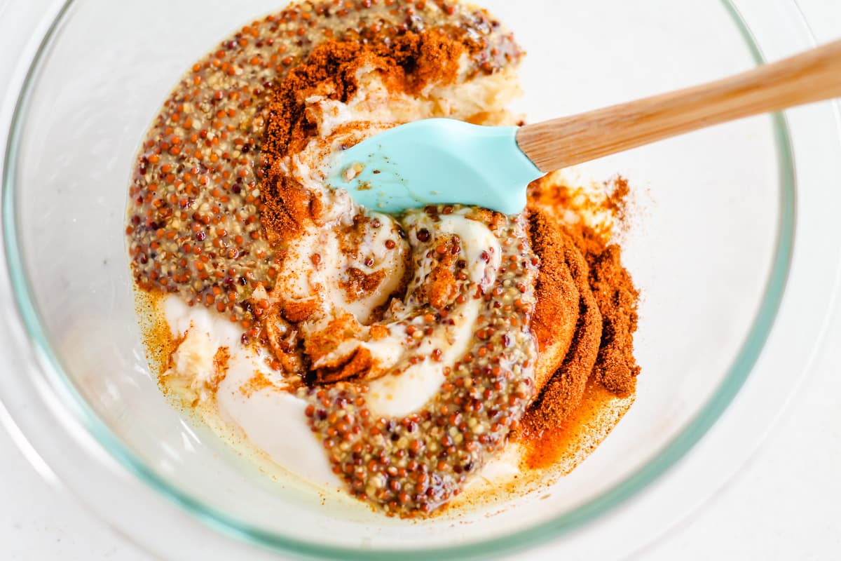 A small spatula stirring ingredients in a bowl.