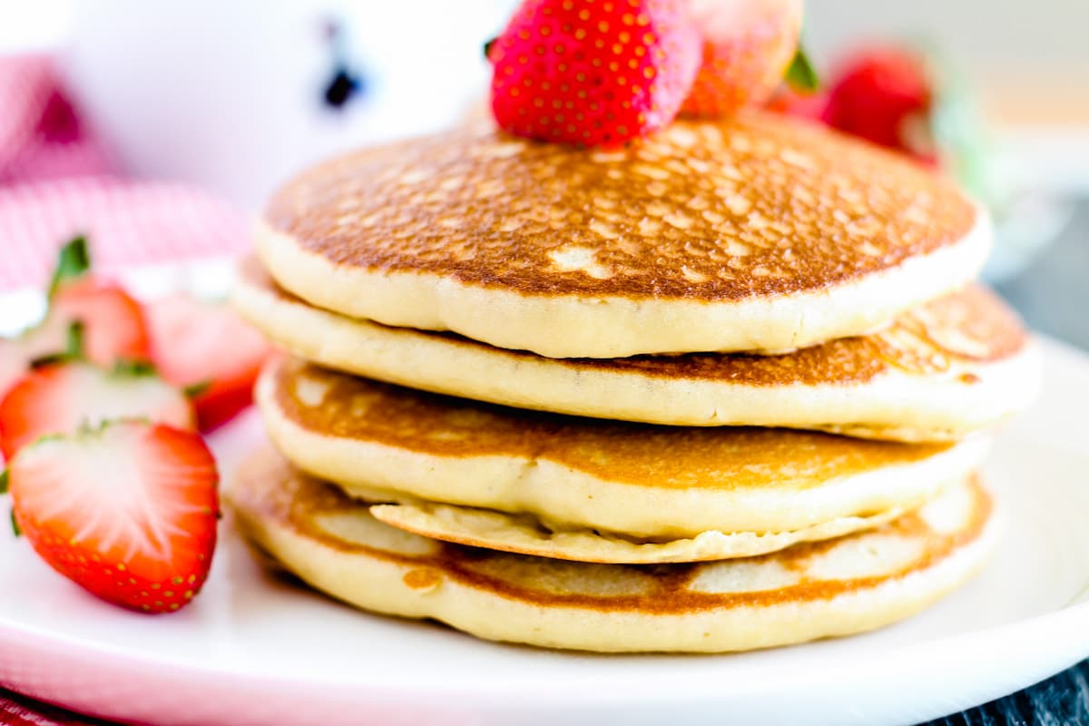 A stack of gluten free pancakes on a plate.