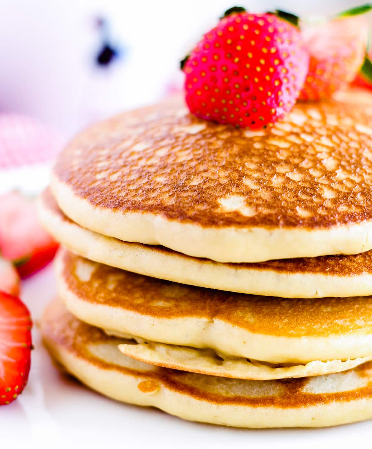 A fluffy stack of gluten free pancakes.