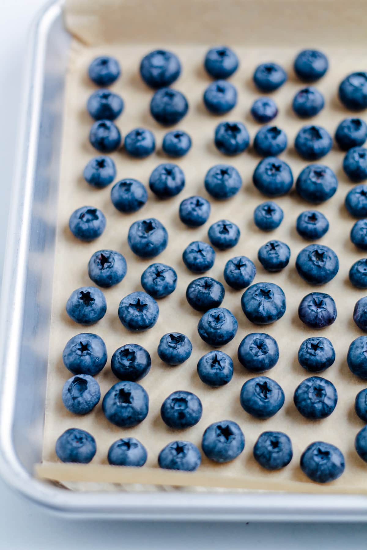 A baking tray of blueberries.