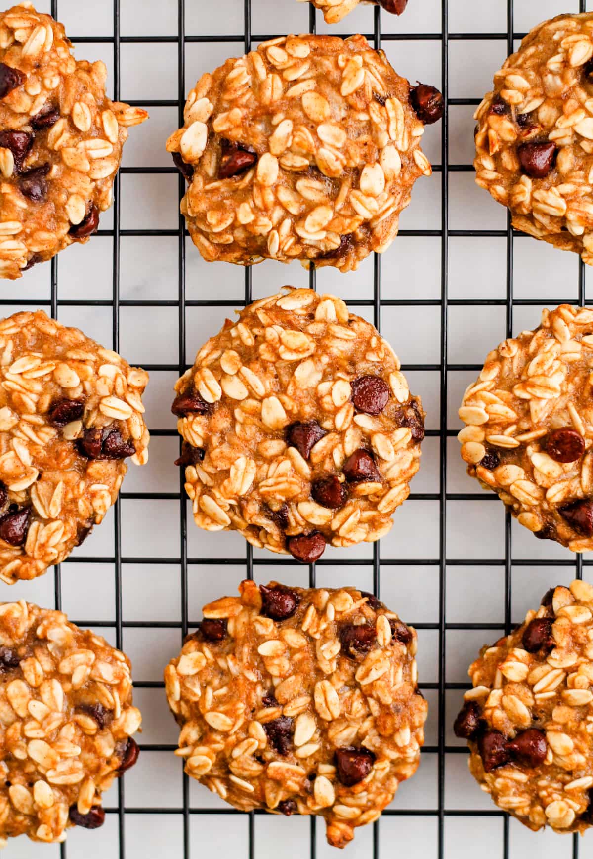 Overhead image of 3-ingredient oatmeal cookies on a wire cooling rack.