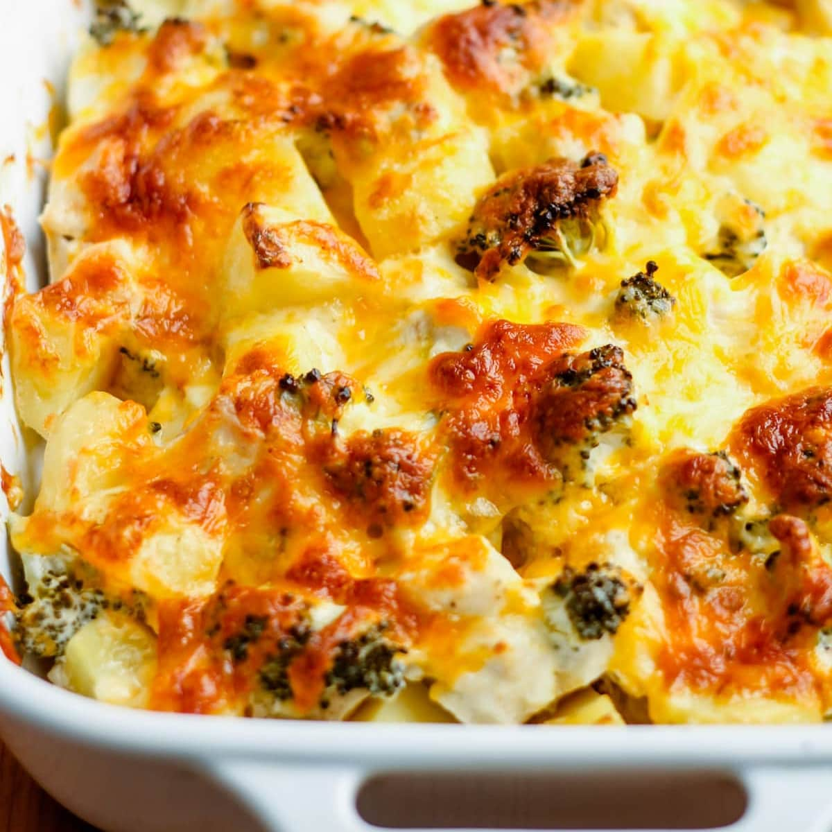 A baking dish with chicken broccoli cauliflower casserole.