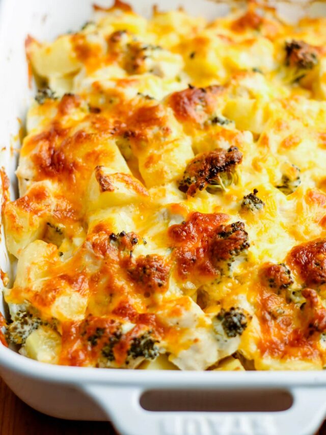 A baking dish of cheesy chicken broccoli potato casserole.