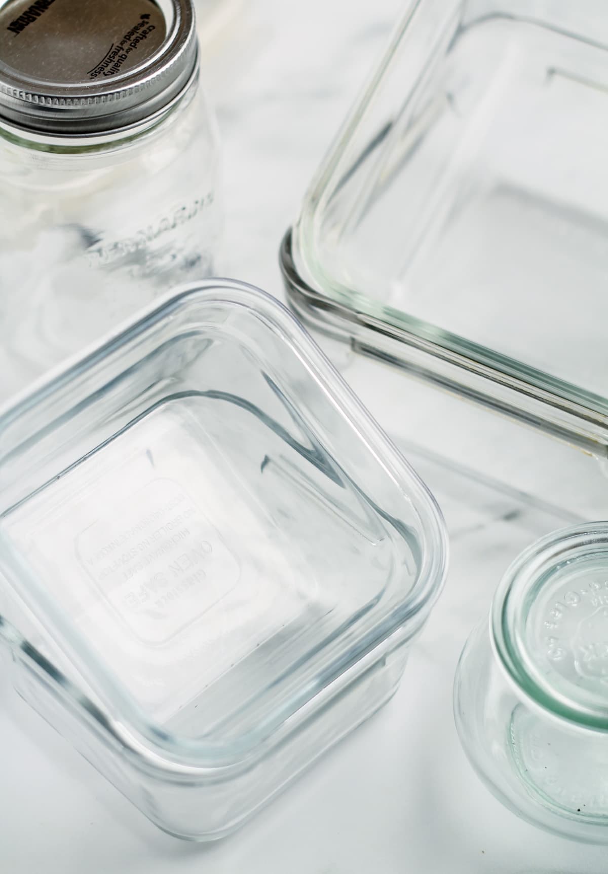 Glass food storage containers on a counter.
