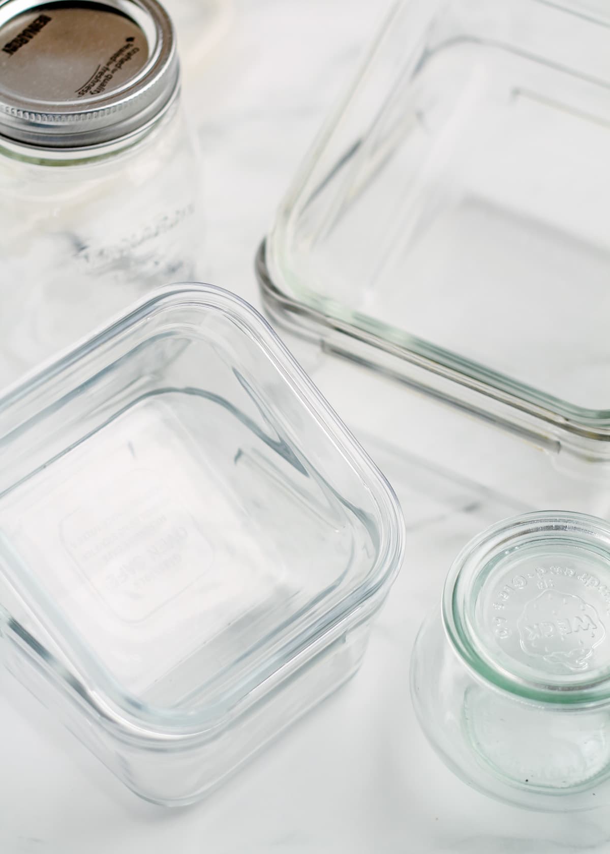 Glass food storage containers on a counter.