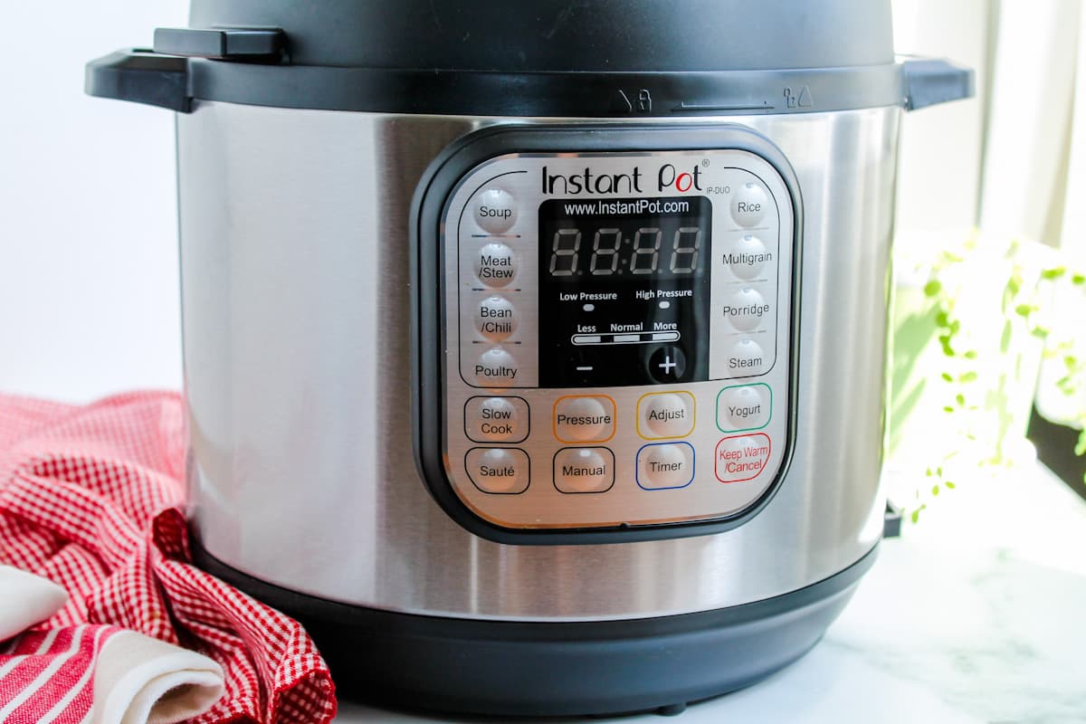 A pressure cooker on a counter.