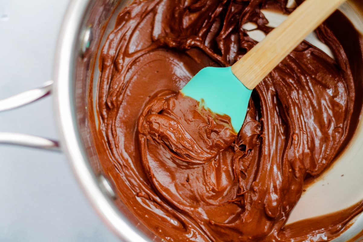 Chocolate being melted in a small saucepan.