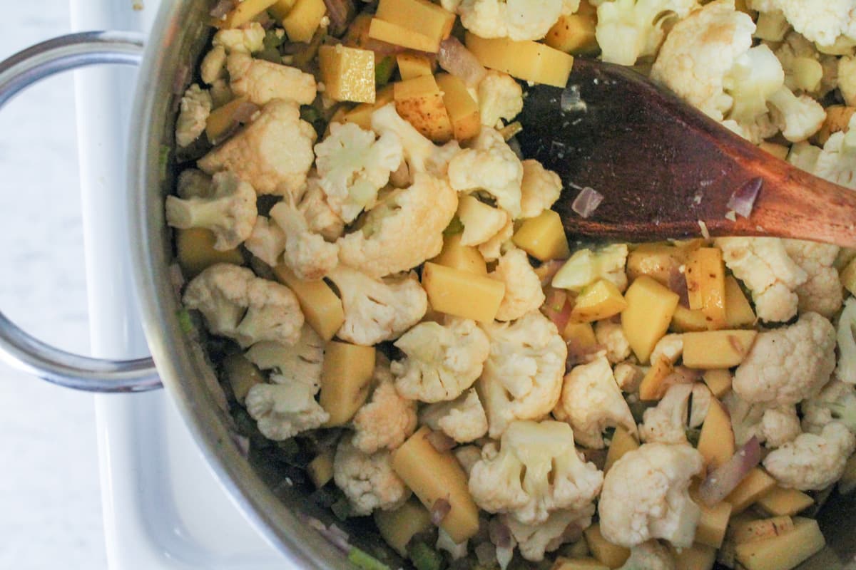 Vegetables in a large pot.