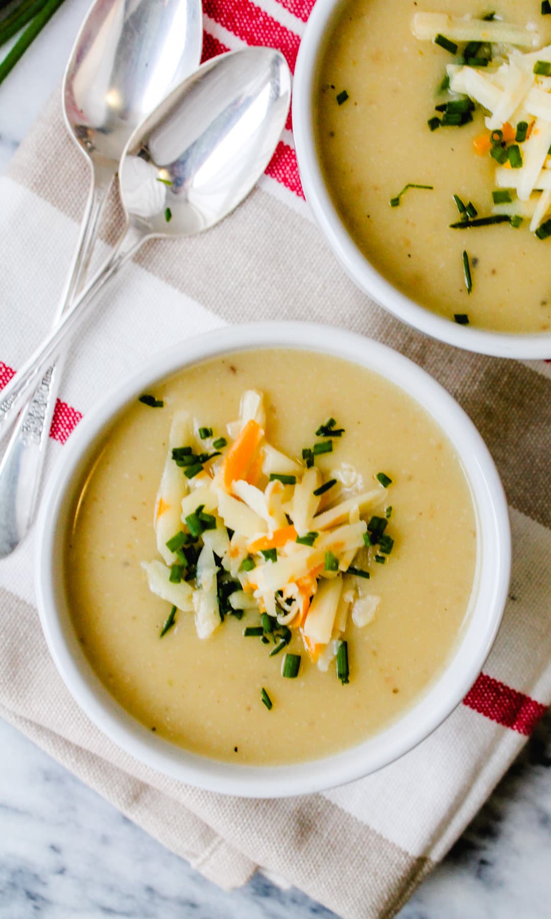 Overhead image of a bowl of cauliflower potato soup.