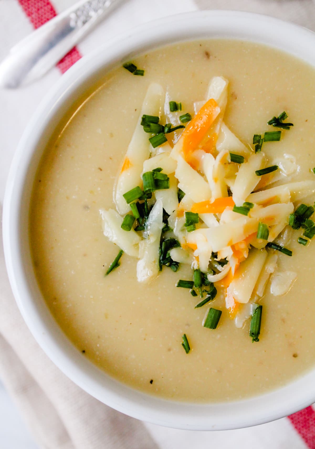 Overhead image of a bowl of cauliflower potato potato soup.