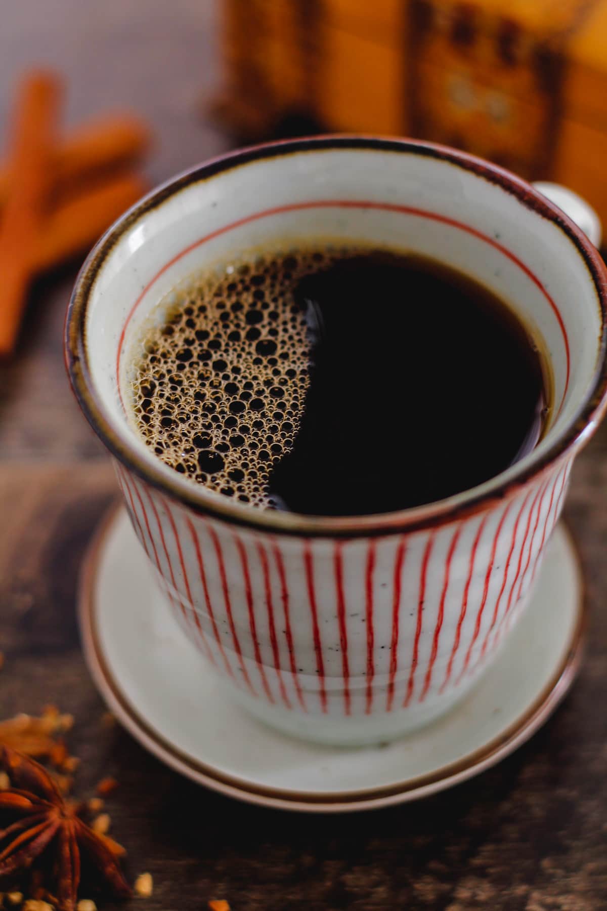 A mug of chai coffee on a counter.