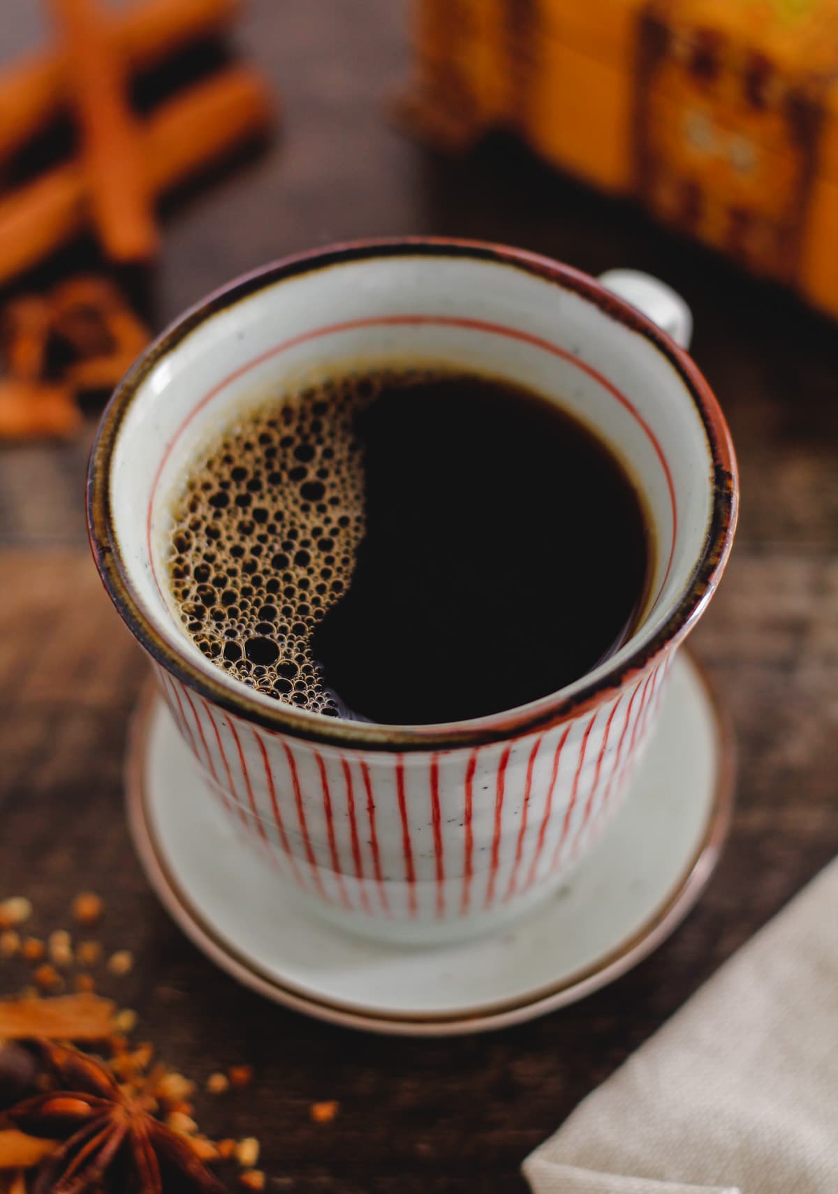 A cup of spiced chai coffee in a mug.