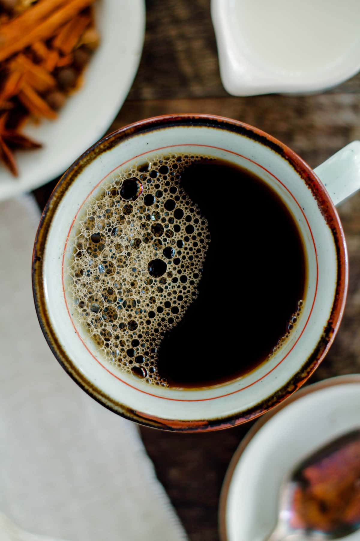 Overhead image of a mug of chai spiced coffee.