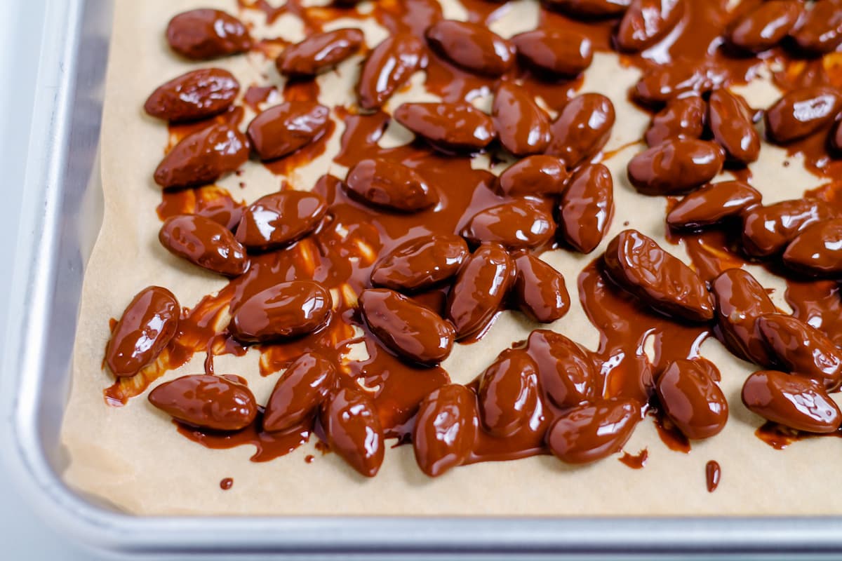 A pan of chocolate coated almonds.