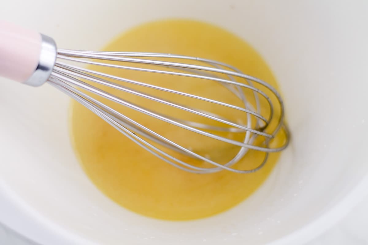 Ingredients being whisked in a bowl.