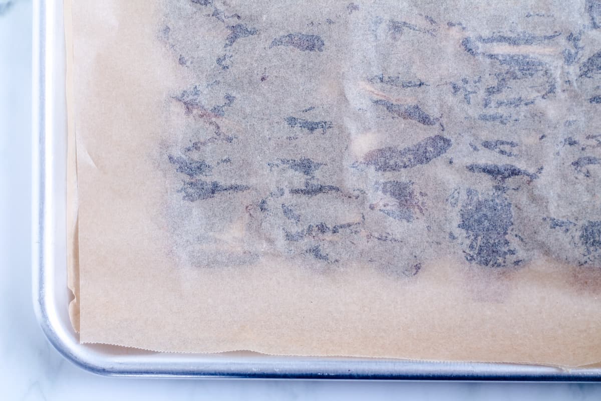 A piece of parchment paper on top of dates.