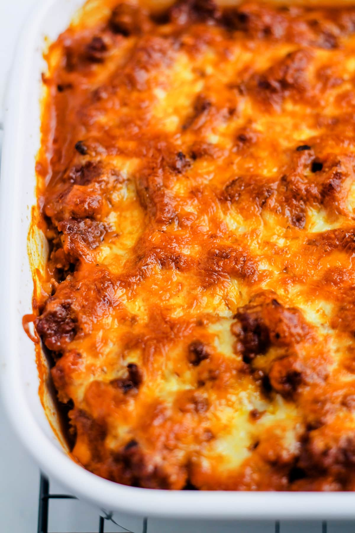 A casserole dish with beef taco bake inside.