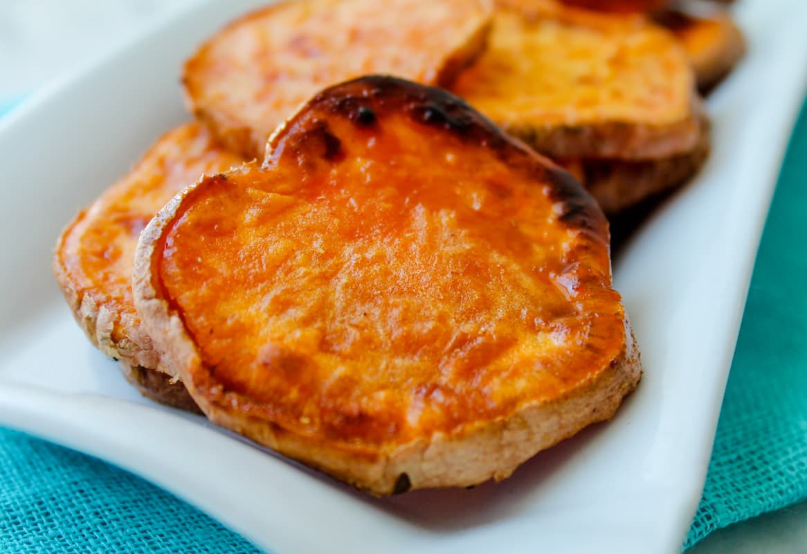 A plate of oven roasted sweet potatoes.