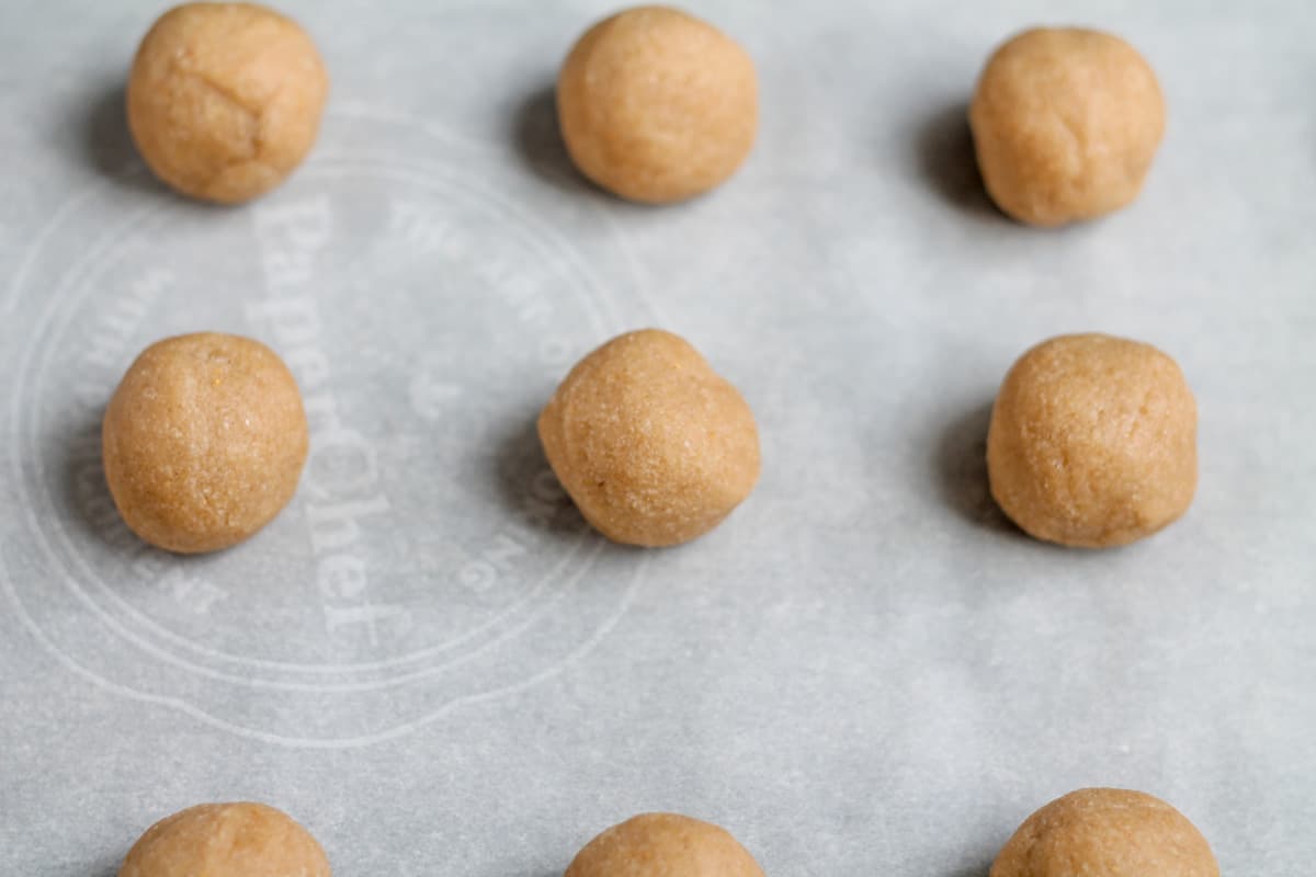 Dough balls on a baking sheet.