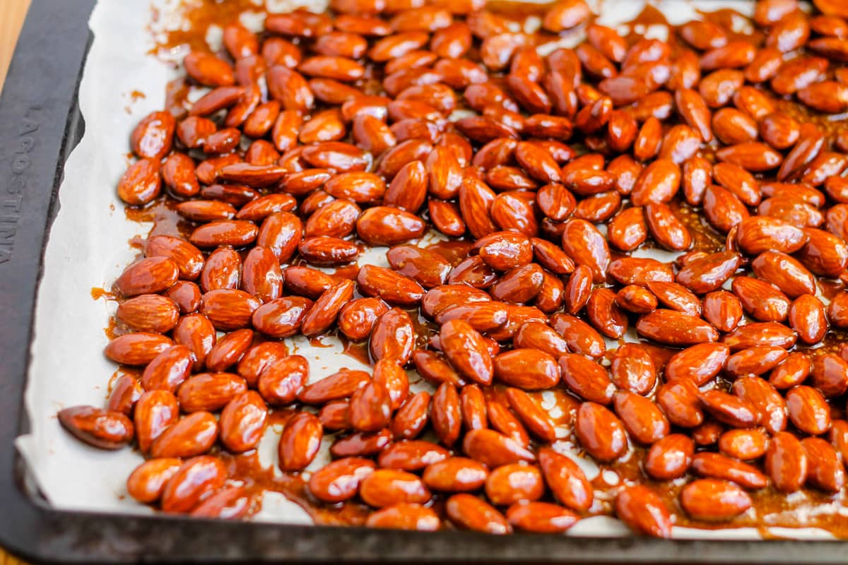 Almonds spread on a baking sheet.