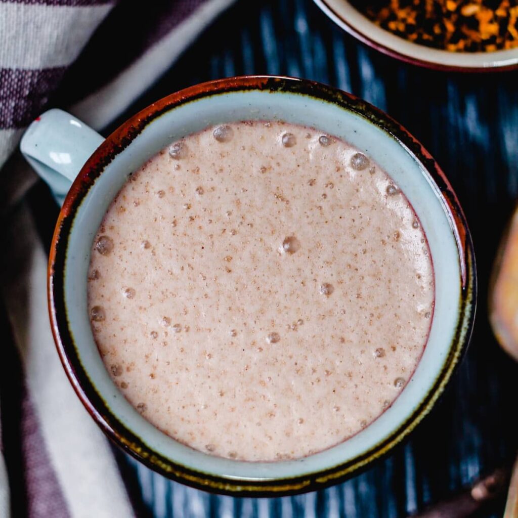 An overhead image of chaga hot chocolate in a mug.