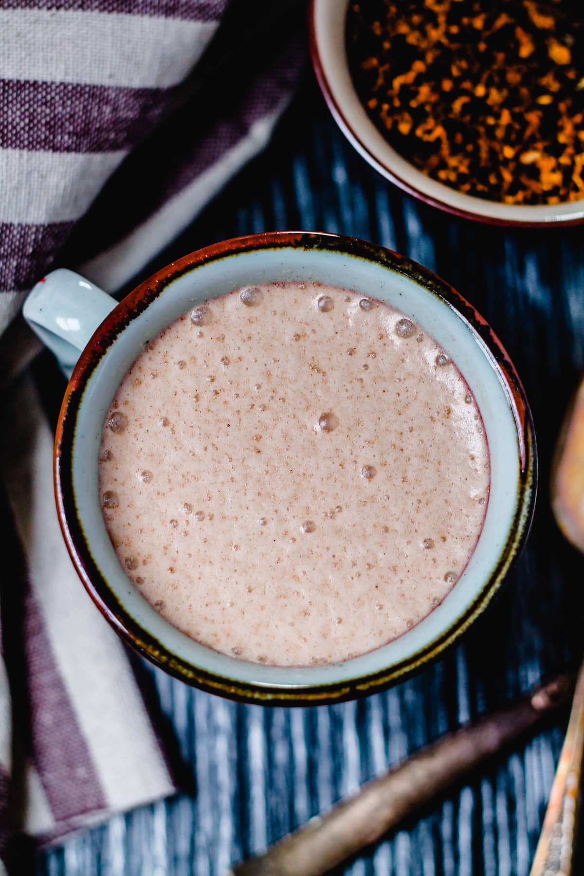 An overhead image of a mug of chaga hot chocolate.