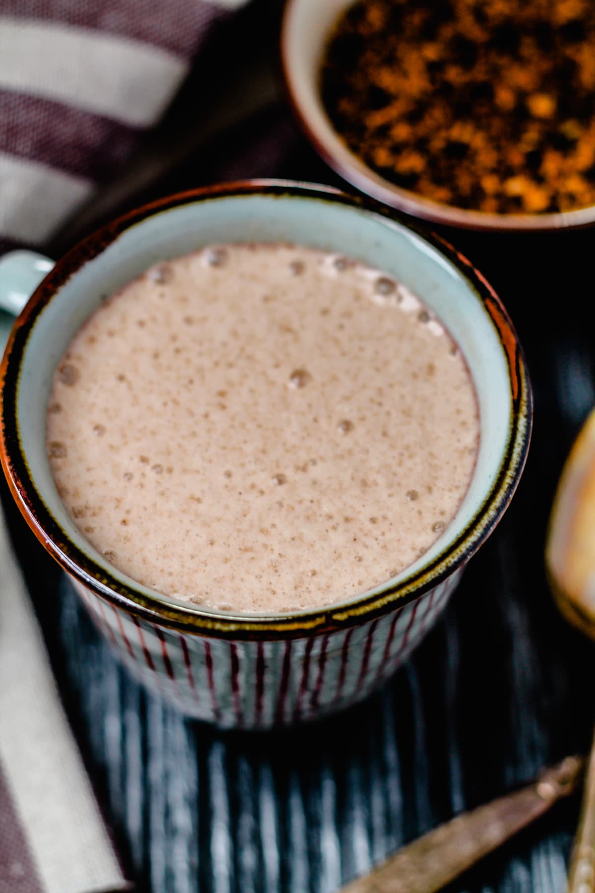 A mug of chaga hot chocolate on a counter.