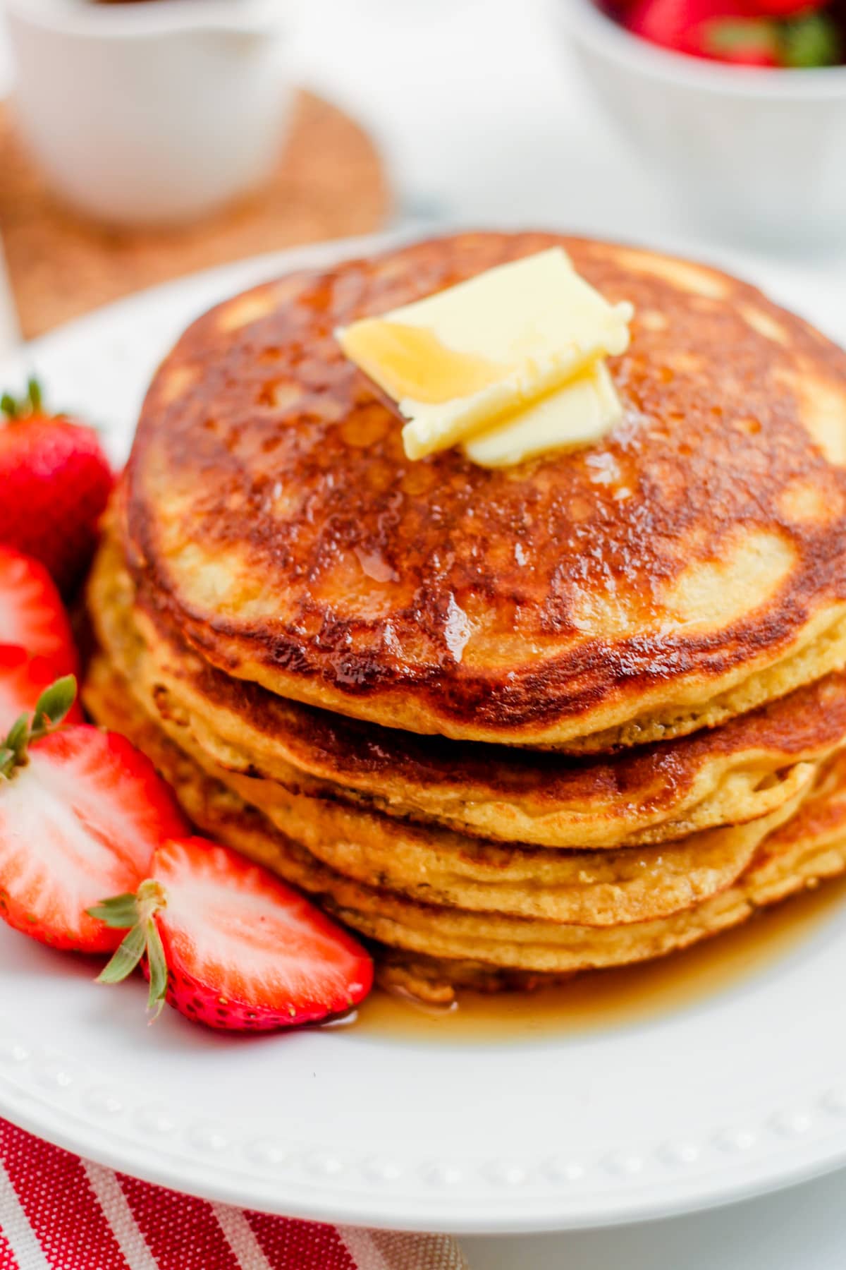 A stack of coconut flour pancakes on a plate.