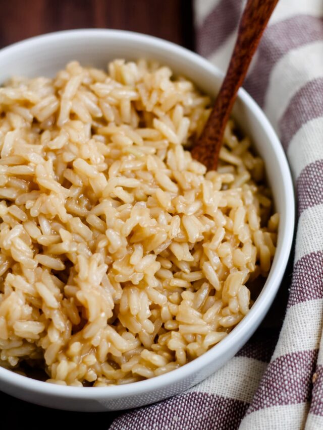 A small bowl of brown rice cooked in broth.