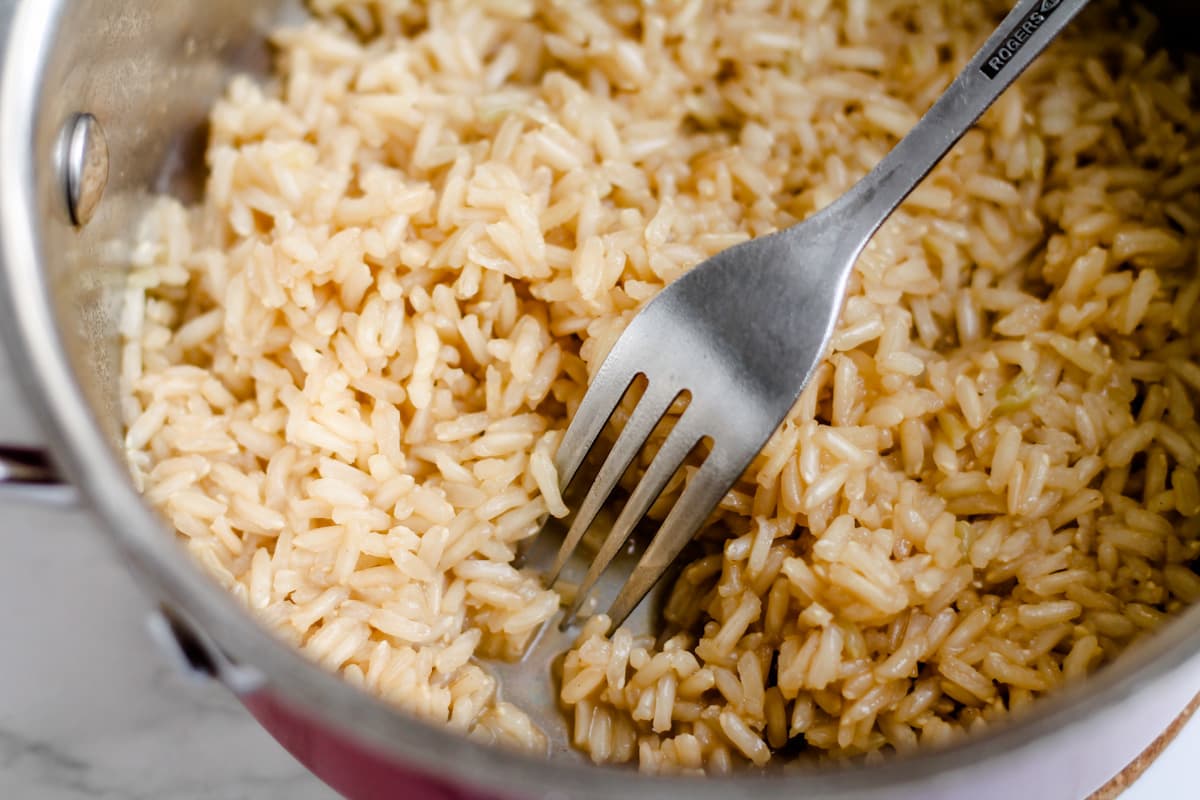 A fork fluffing rice.