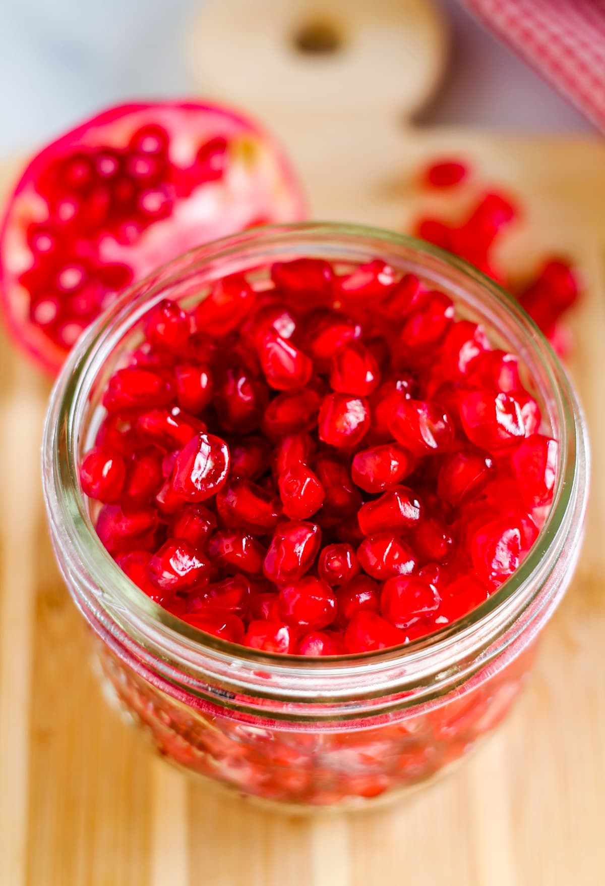 A jar of pomegranate seeds.